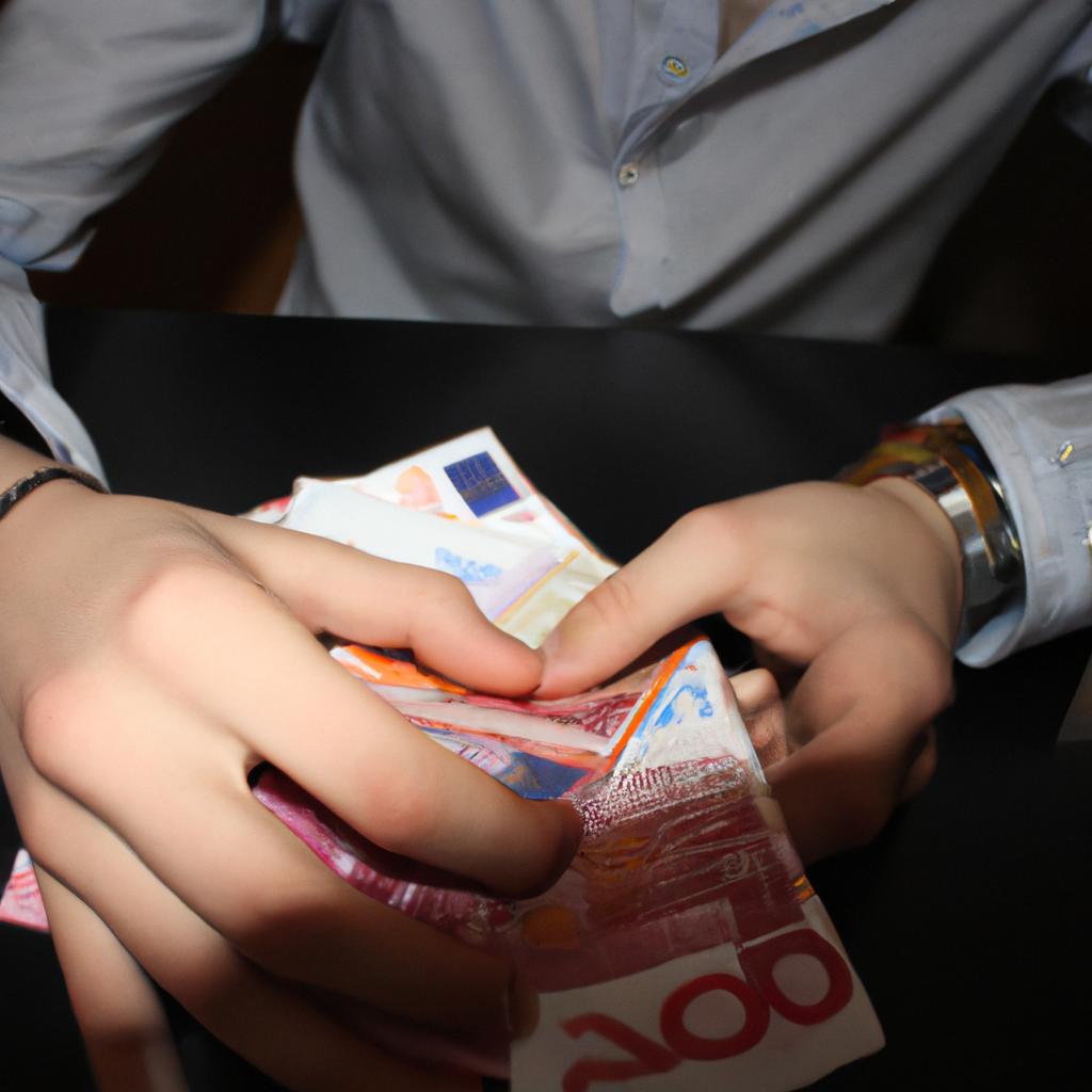 Person counting money, making notes