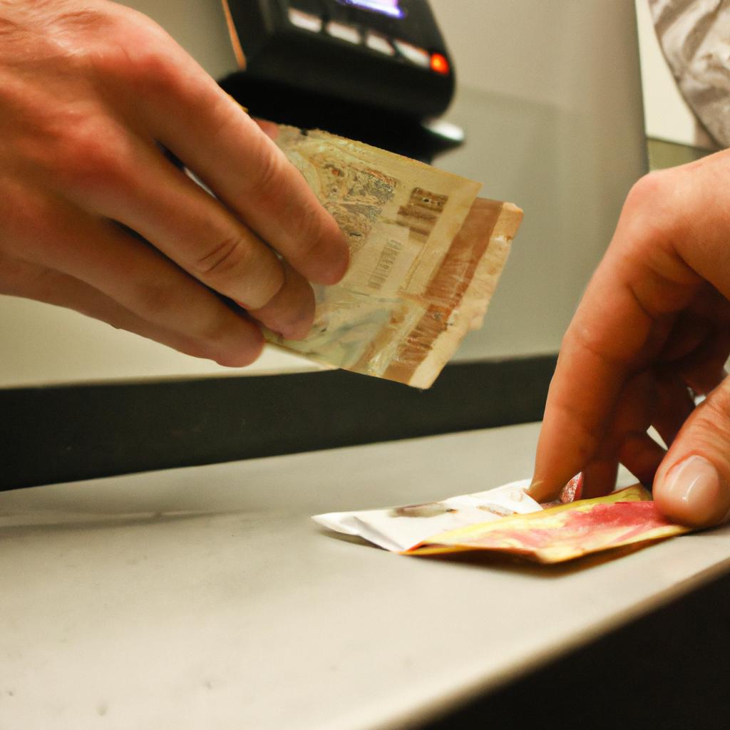 Person exchanging currency at counter