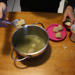 Person preparing matzo ball soup